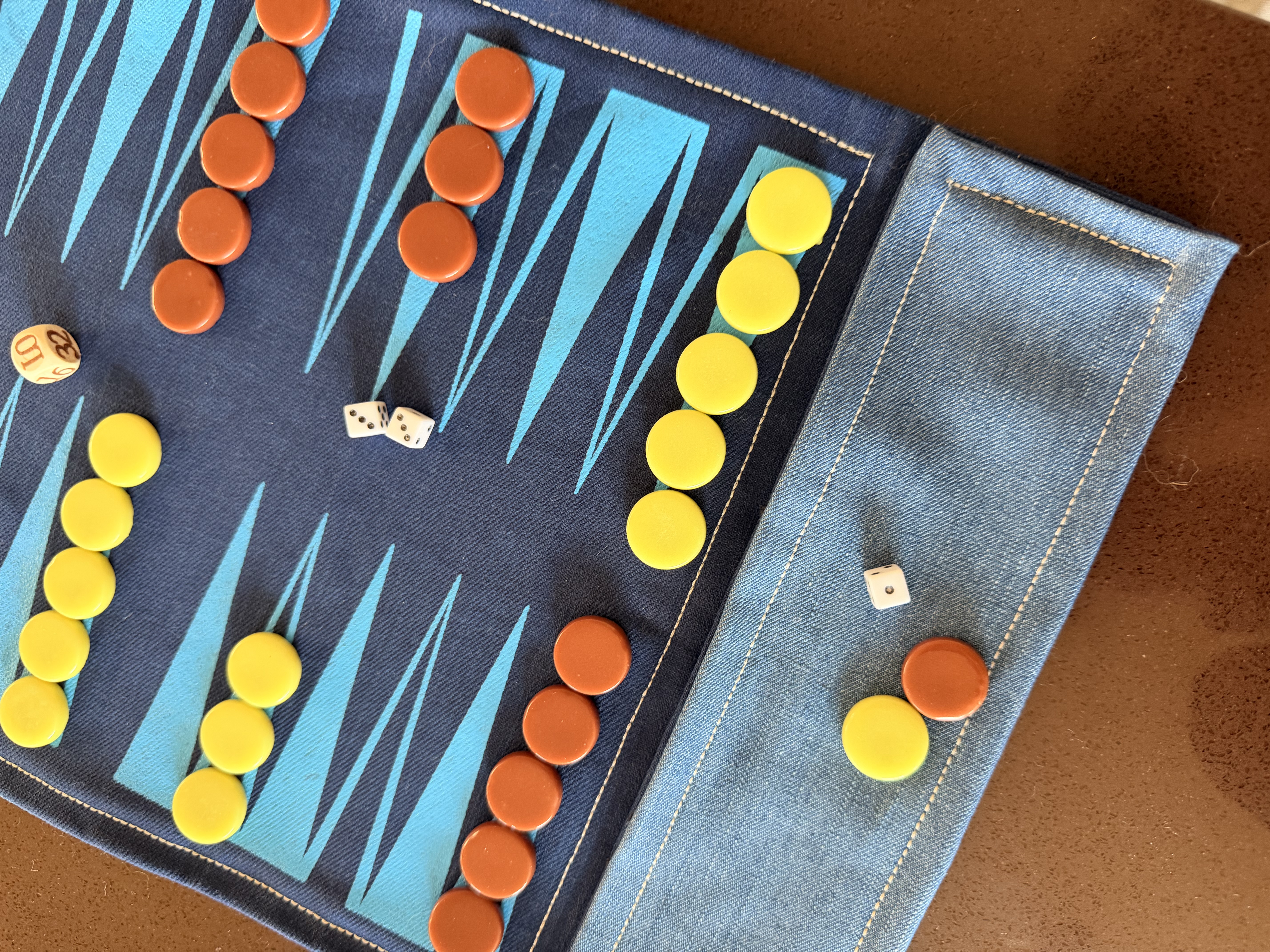 Close-up of I'm Board handcrafted backgammon pieces